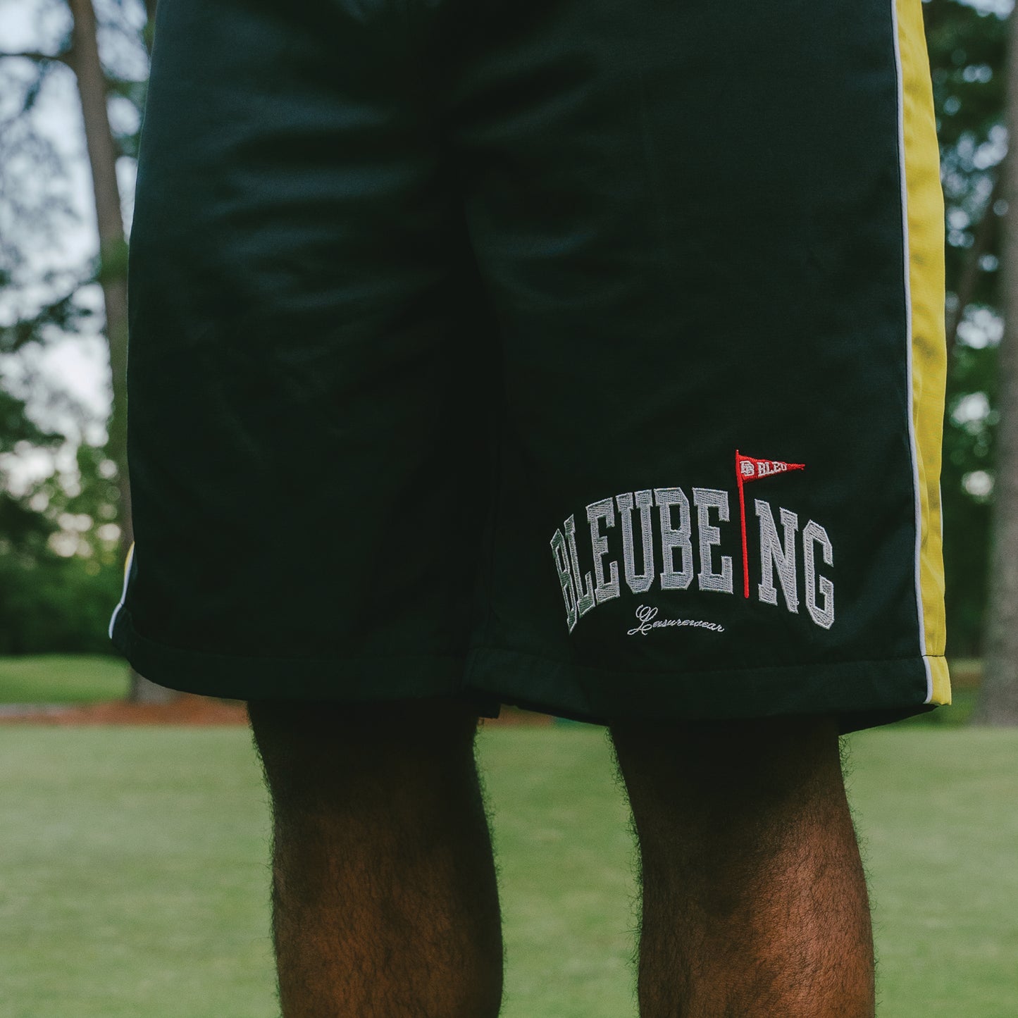 athletic windbreaker shorts, nature background