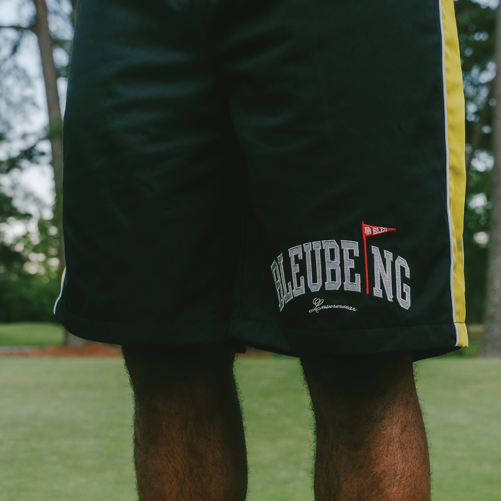 athletic windbreaker shorts, nature background