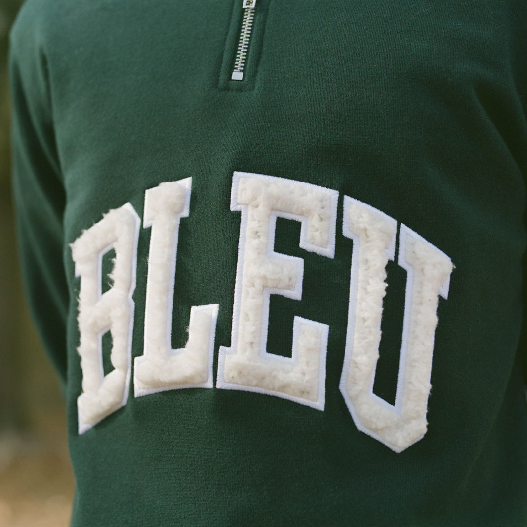 Regular fit Heavyweight, 10.3 oz Sherpa fabric logo Applique Olive green logo color Woven cuff tag Half Zip Sweatshirt